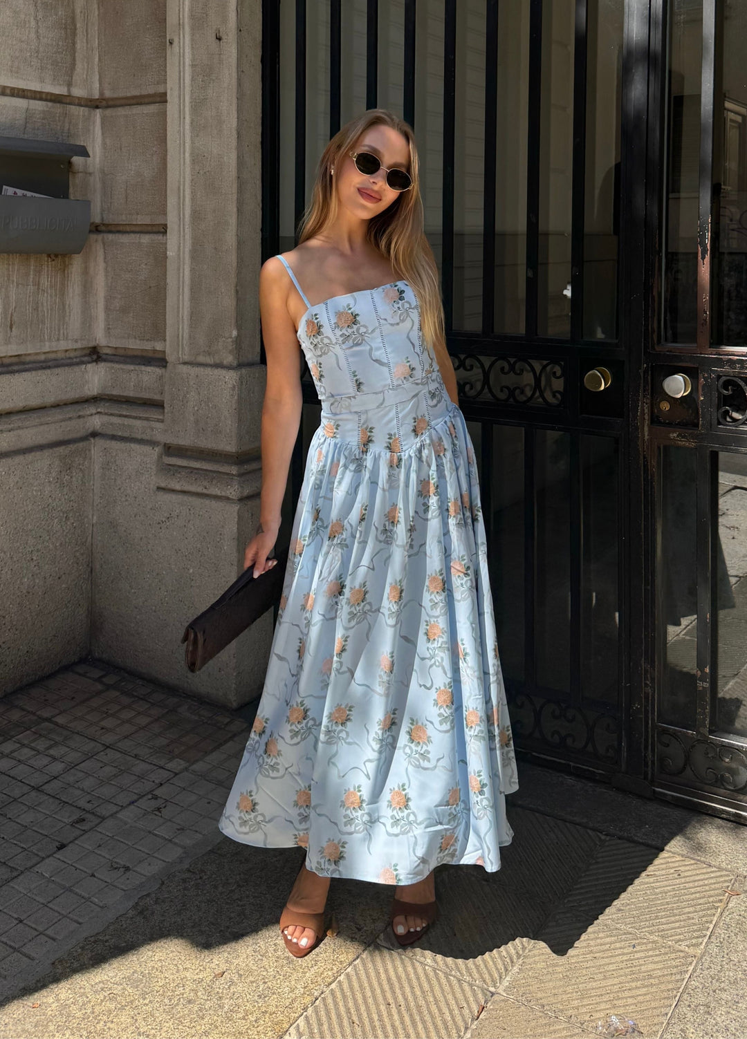 Light blue floral midi dress with spaghetti straps and tiered skirt