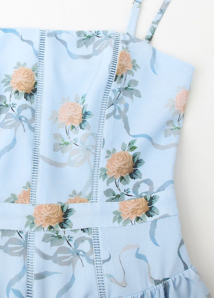 Close-up of light blue floral fabric with stitched seam lines