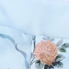 Close-up of light blue floral lining with ruched seam and zipper
