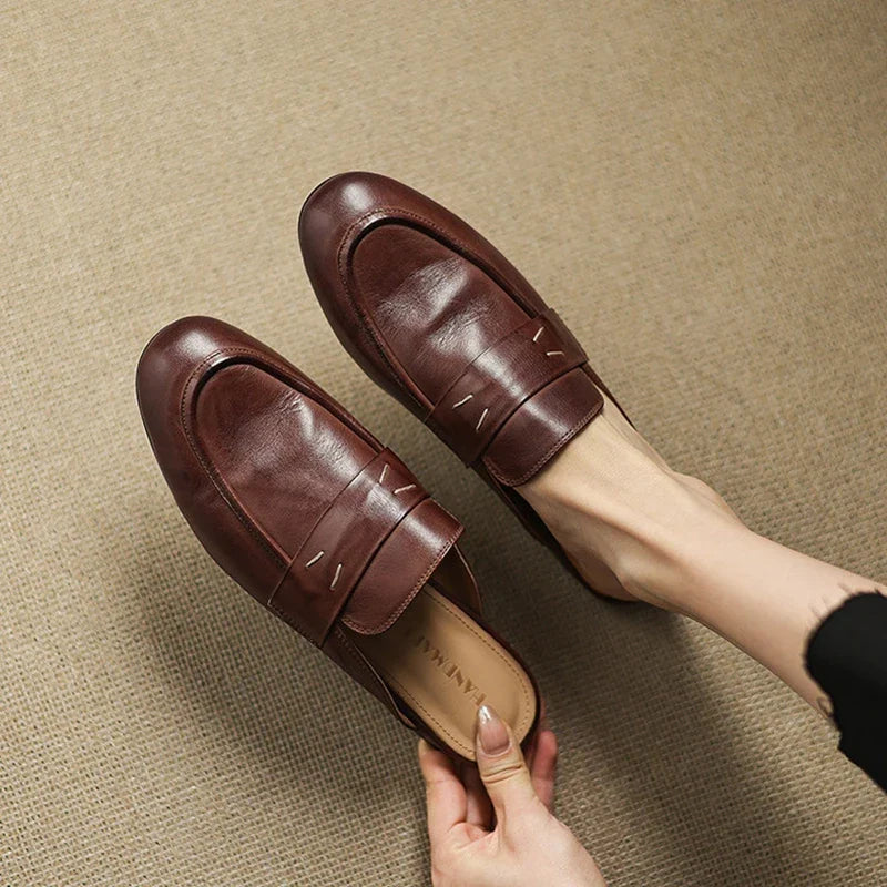 Pair of brown leather mules, square toe slip-on with stitched strap across the front