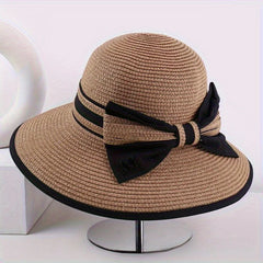 Brown wide brim sun hat with black ribbon band and bow