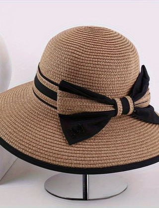 Brown wide brim sun hat with black ribbon band and bow