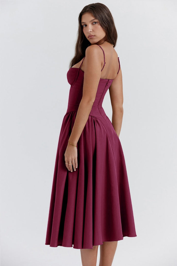 Wine red corset sundress with thin straps and a pleated flared midi skirt