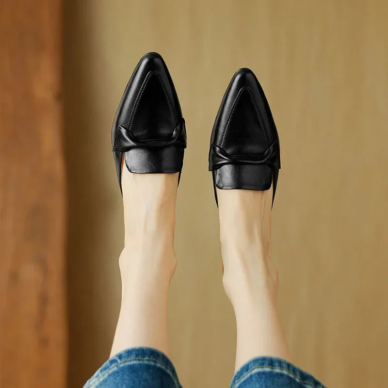 Black genuine leather mules, back view pair with closed heel and slip-on fit