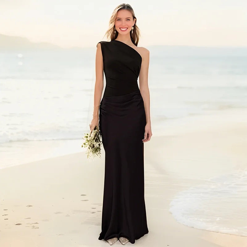 One-shoulder maxi dress in black, sleeveless fitted bodice and floor-length skirt