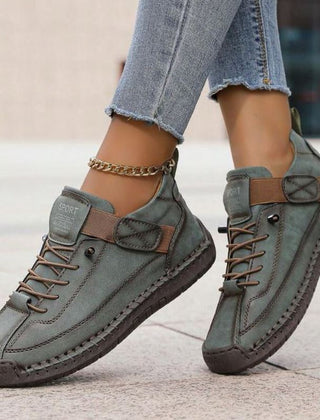 Orthopedic comfort sneaker in olive-green with lace-up and side strap detail.