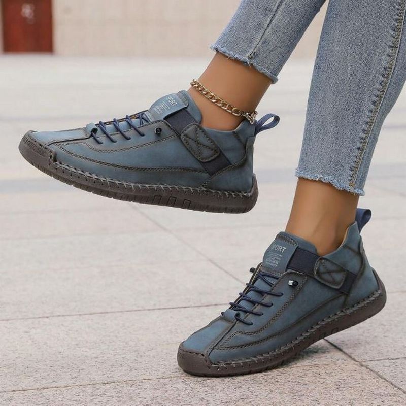 Orthopedic comfort sneaker in slate blue with lace-up and ankle strap.