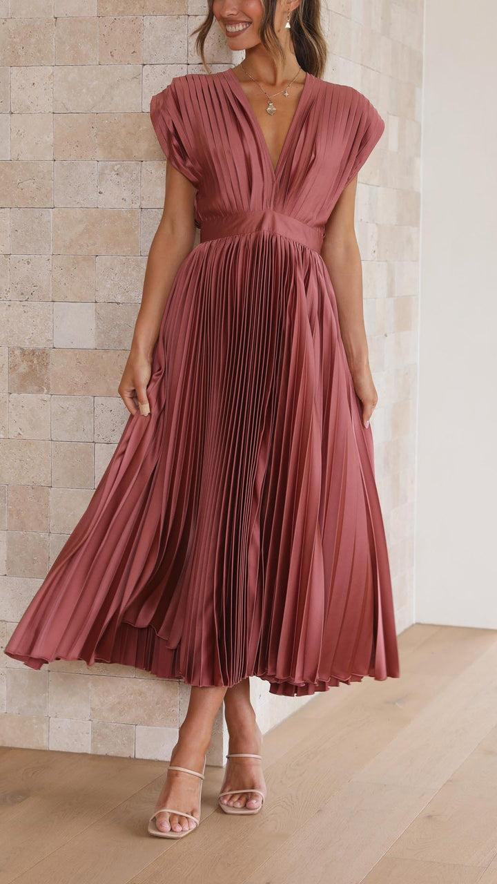 Dusty pink pleated V-neck dress with cap sleeves and cinched waist