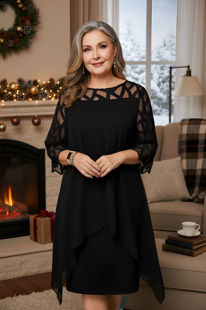 Black lace dress with sheer patterned sleeves and layered asymmetrical hem
