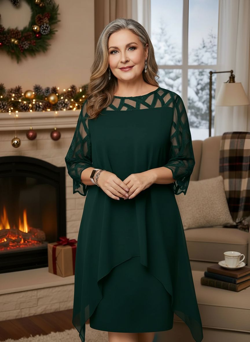 Green lace dress with geometric lace yoke, sheer sleeves, and layered asym hem