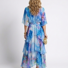 Blue tie-dye sheer tiered maxi dress with V-neck and tie waist, back view