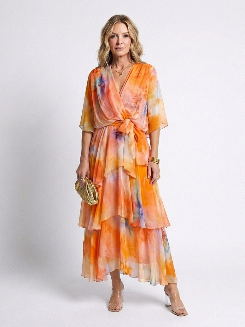 Orange tie-dye sheer layered maxi dress with V-neck and tie waist, tiered skirt
