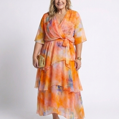 Orange sheer tiered maxi dress with V-neck and tie waist, layered ruffle hem