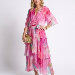 Pink sheer layered maxi dress with V-neck and tie waist, tiered ruffle hem