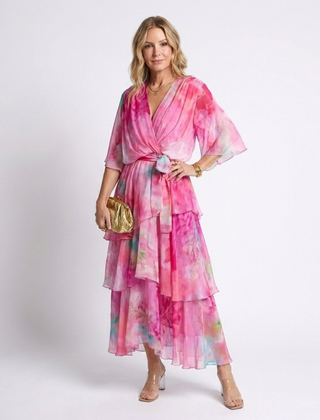 Pink sheer layered maxi dress with V-neck and tie waist, tiered ruffle hem