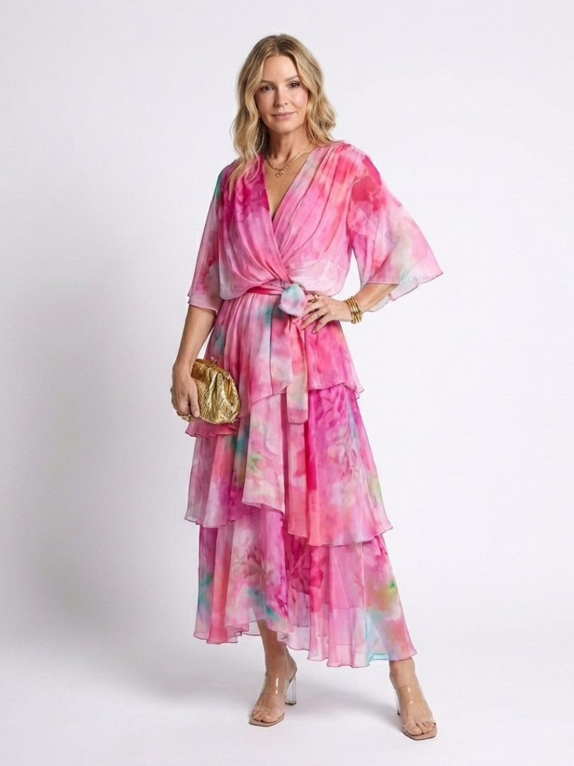 Pink sheer layered maxi dress with V-neck and tie waist, tiered ruffle hem