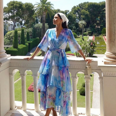 Blue tie-dye sheer maxi dress with V-neck and tie waist, layered tiers, side view