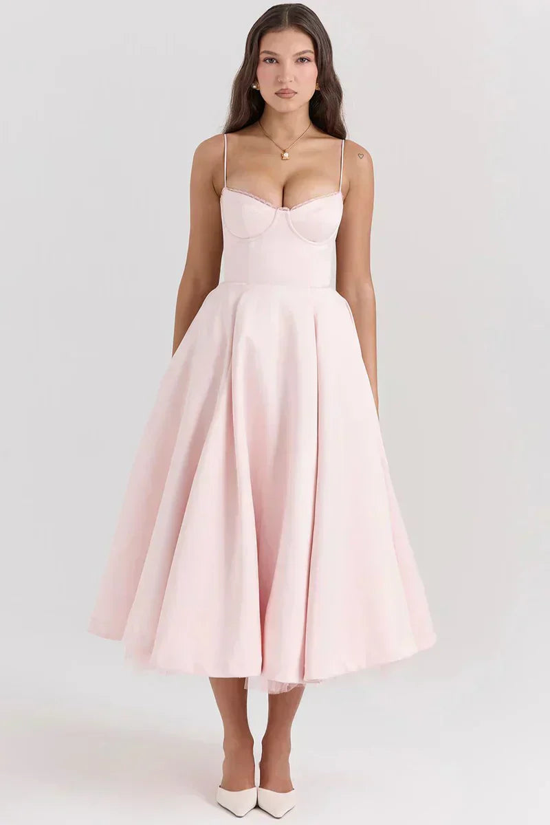 Blush pink fit-and-flare dress with spaghetti straps, sweetheart bodice, tulle skirt.