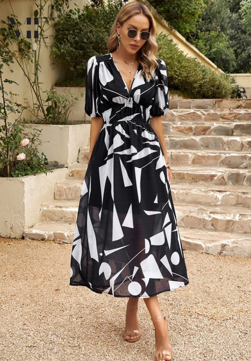 Black-and-white floral printed midi dress with V-neck, puff sleeves, and tie belt