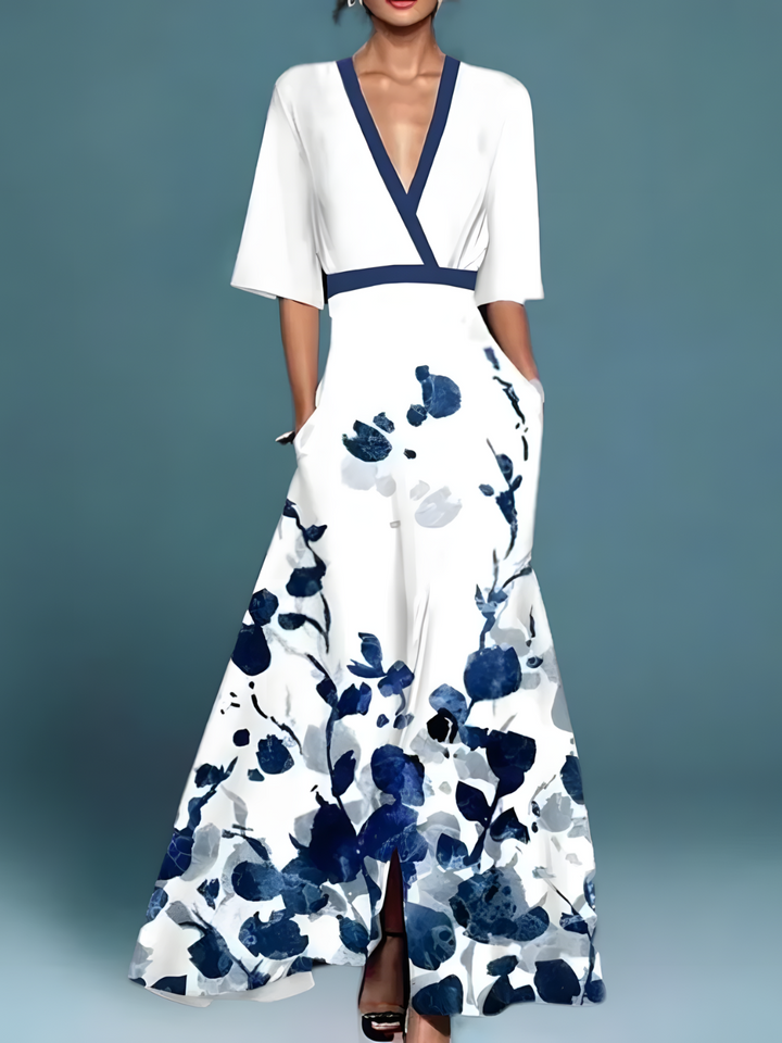 Floral maxi dress with V-neck, short sleeves, blue trim, white base with dark blue blooms