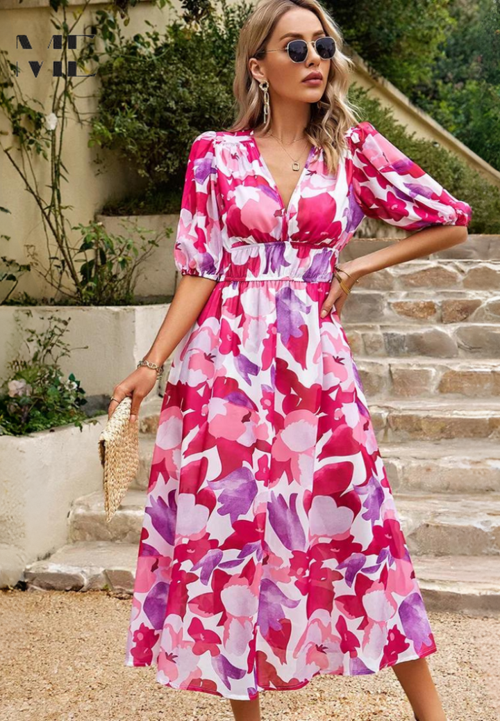 Pink floral midi dress with V-neck, puff sleeves, and cinched waist