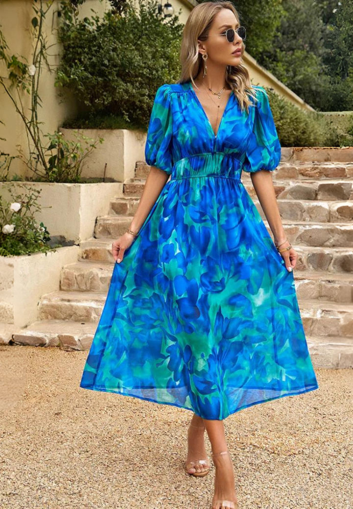 Blue V-neck midi dress with puff sleeves and ruched waist in bright textured color