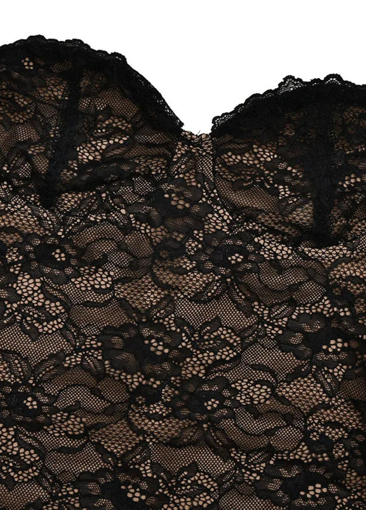 Black lace fabric close-up showing scalloped lace trim at the neckline