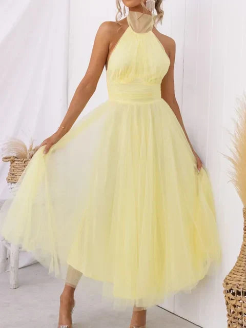 Yellow halter turtleneck midi dress with sleeveless bodice and voluminous tulle skirt