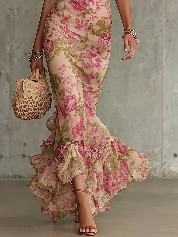 Vintage floral maxi dress with asymmetrical ruffle hem and puff sleeves; pink-green print.