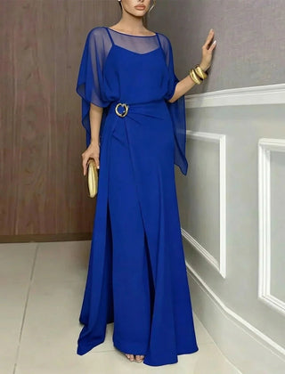 Blue long jumpsuit with sheer overlay draped sleeves and circular ring-belt.