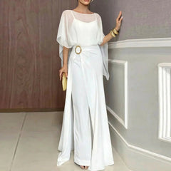 White jumpsuit set with sheer overlay poncho sleeves and ring belt detail.