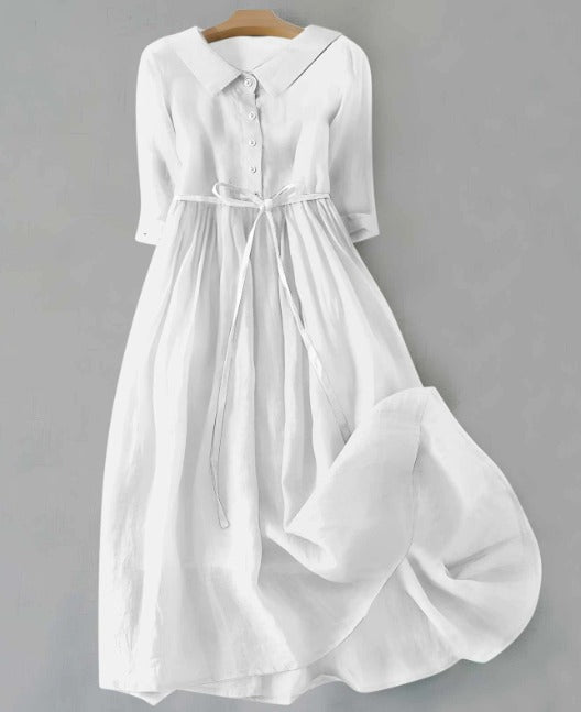 White short-sleeve dress with button front and gathered waist, tied belt