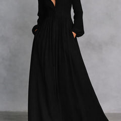 Black long-sleeve maxi dress with V-neck and gathered, flowing skirt