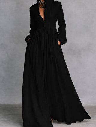 Black long-sleeve maxi dress with V-neck and gathered, flowing skirt