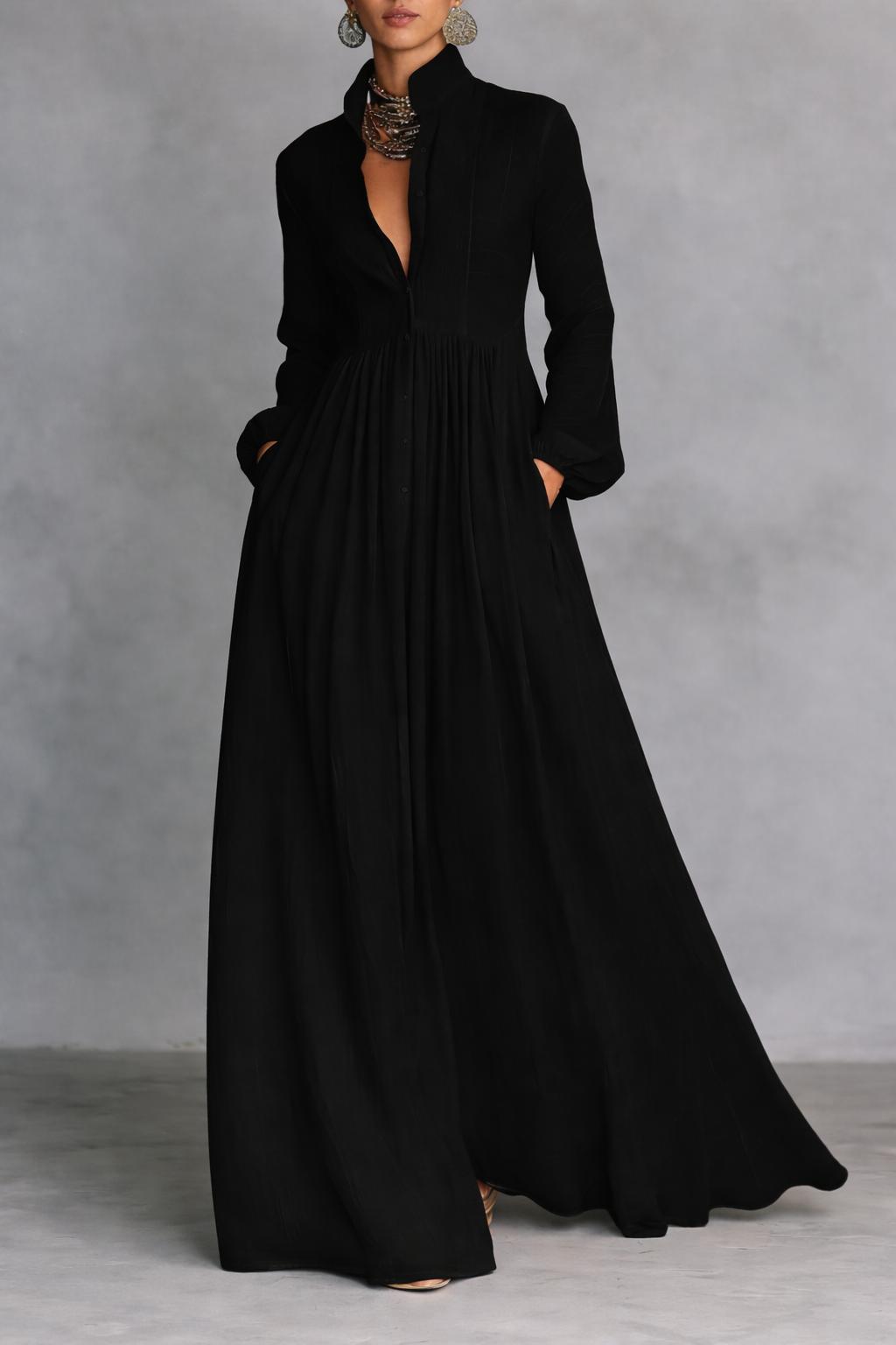 Black long-sleeve maxi dress with V-neck and gathered, flowing skirt