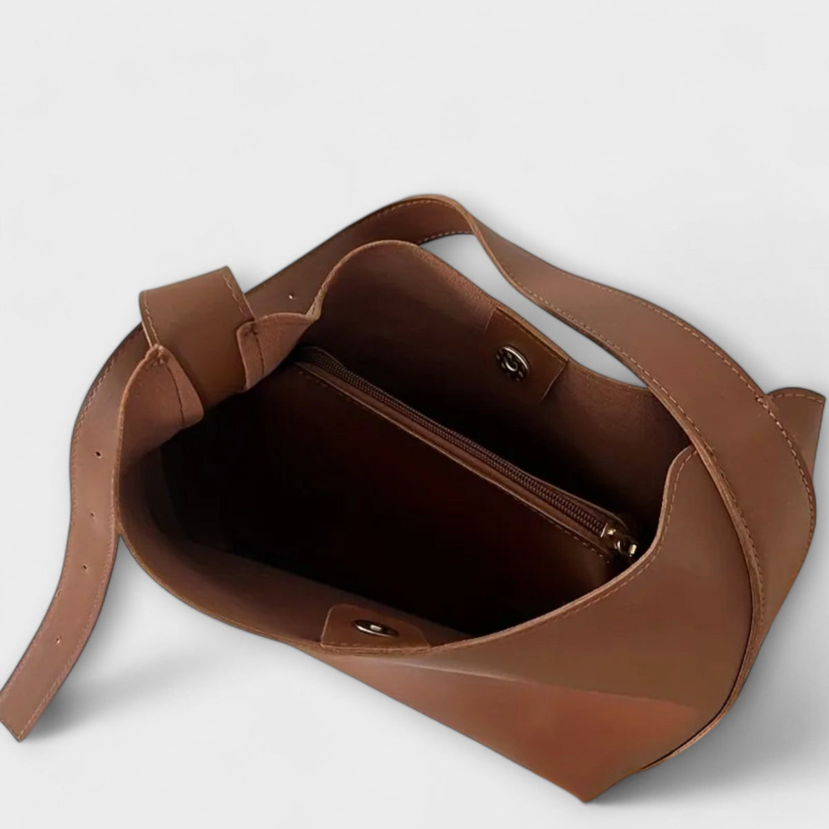 Brown leather tote-style shoulder bag open top, inner zip pocket visible