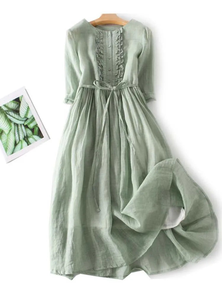Light green linen dress back with pleated skirt and waist tie, short sleeves