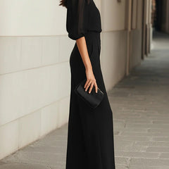 Black blouse and wide-leg pants set, side view with puff sleeves