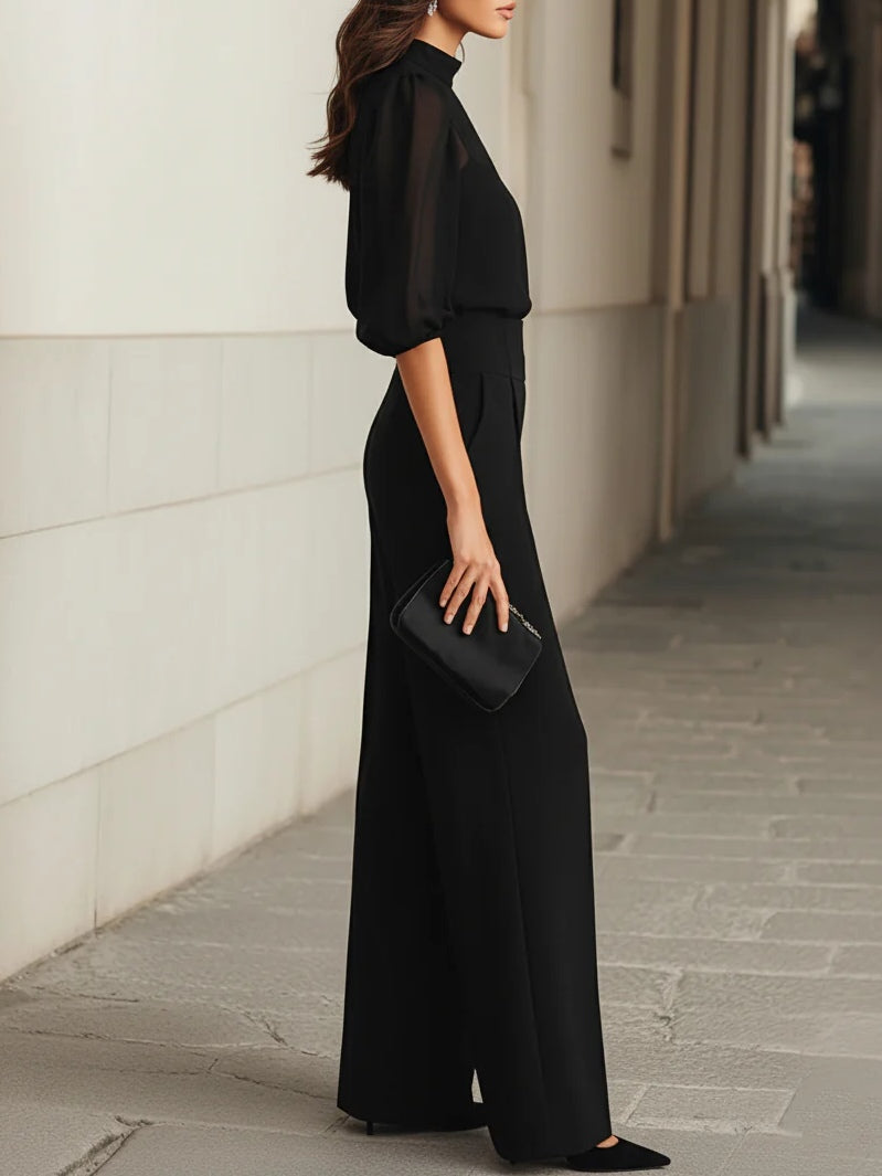 Black blouse and wide-leg pants set, side view with puff sleeves