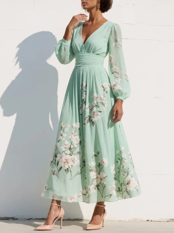 Mint green floral midi dress with V-neck, long sheer sleeves and pleated skirt