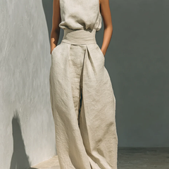 Beige sleeveless top and wide-leg pants set with waist tie and front pleats