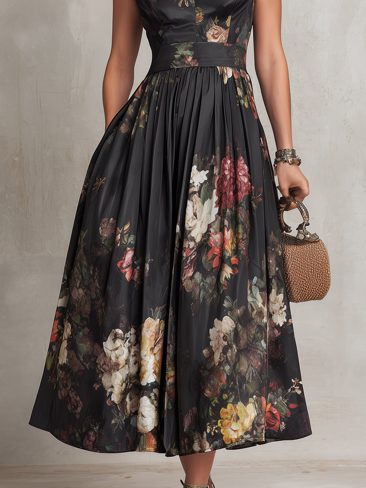 Sleeveless midi dress with dark floral print, pleated skirt, and fitted waist panel