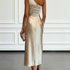 Champagne-gold satin one-shoulder midi dress with ruched back and fitted waist