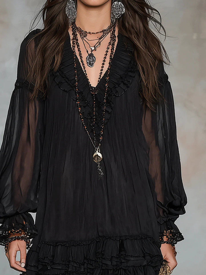 Black mini dress front with V neckline and layered ruffle hem