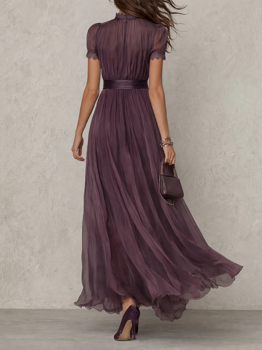Lace-detail maxi dress in dark plum, cinched waist, short puff sleeves, layered flowing skirt