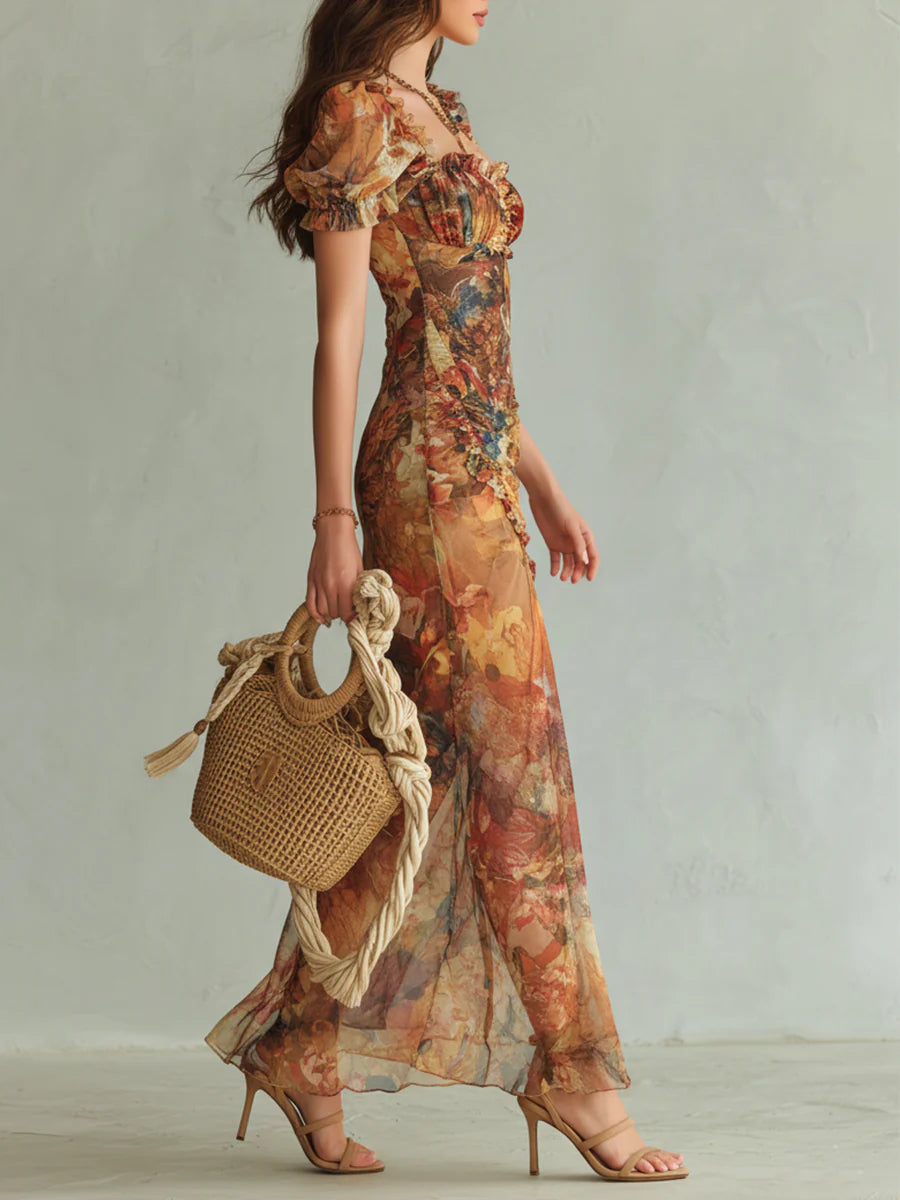 Orange bohemian chiffon maxi dress, side view with short puff sleeves and thigh slit