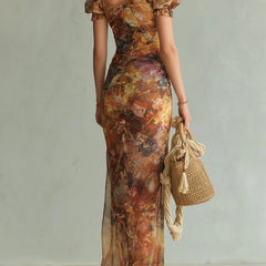 Orange chiffon maxi dress back view with puff sleeves and multicolor paint print