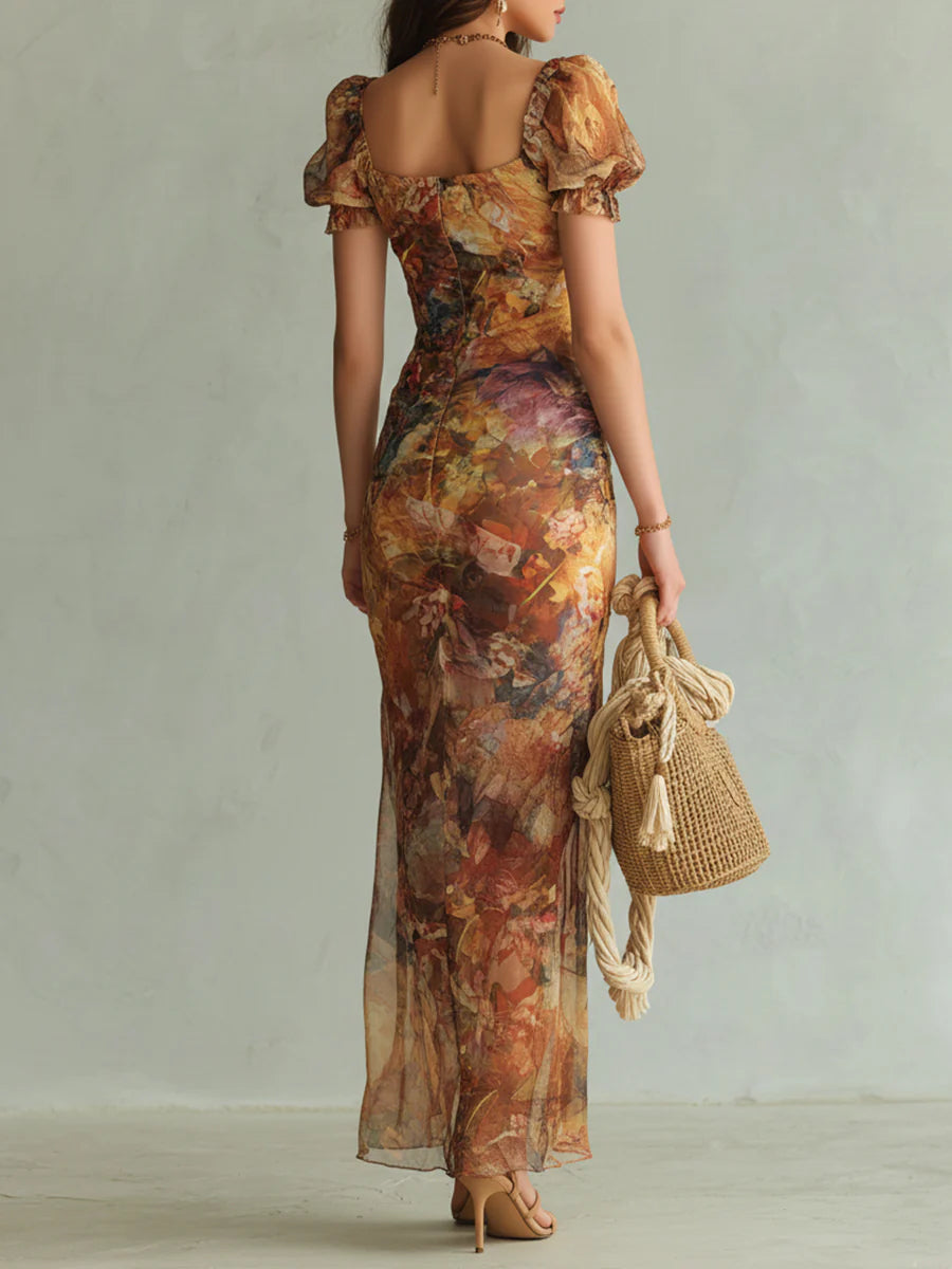 Orange chiffon maxi dress back view with puff sleeves and multicolor paint print
