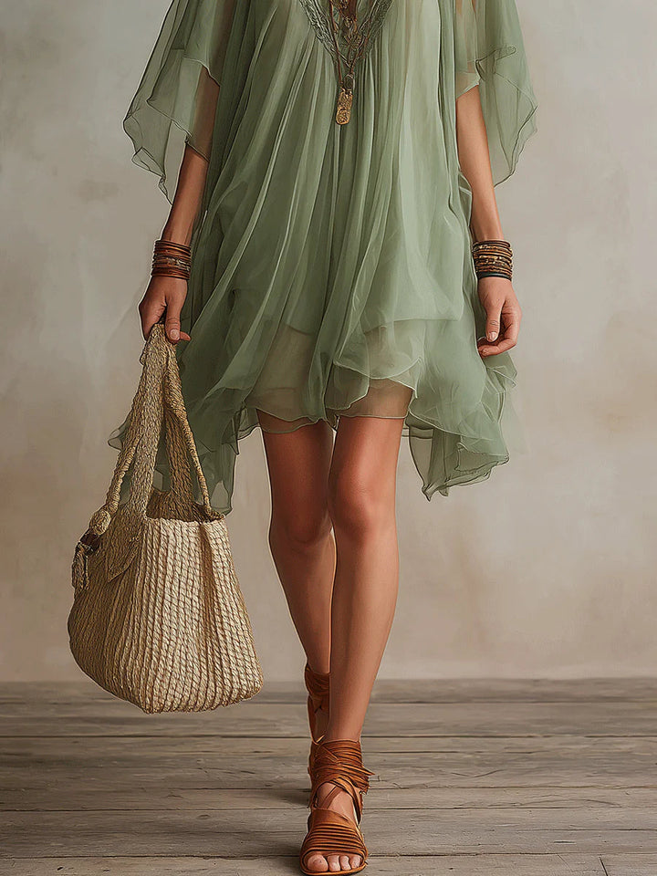 Olive layered mini dress with sheer flutter sleeves and V-neck