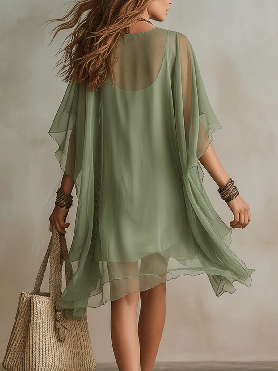 Olive mini dress with sheer back panel and tiered hem